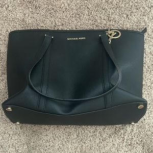 Lightly used black Michael Kors tote/purse with gold accents